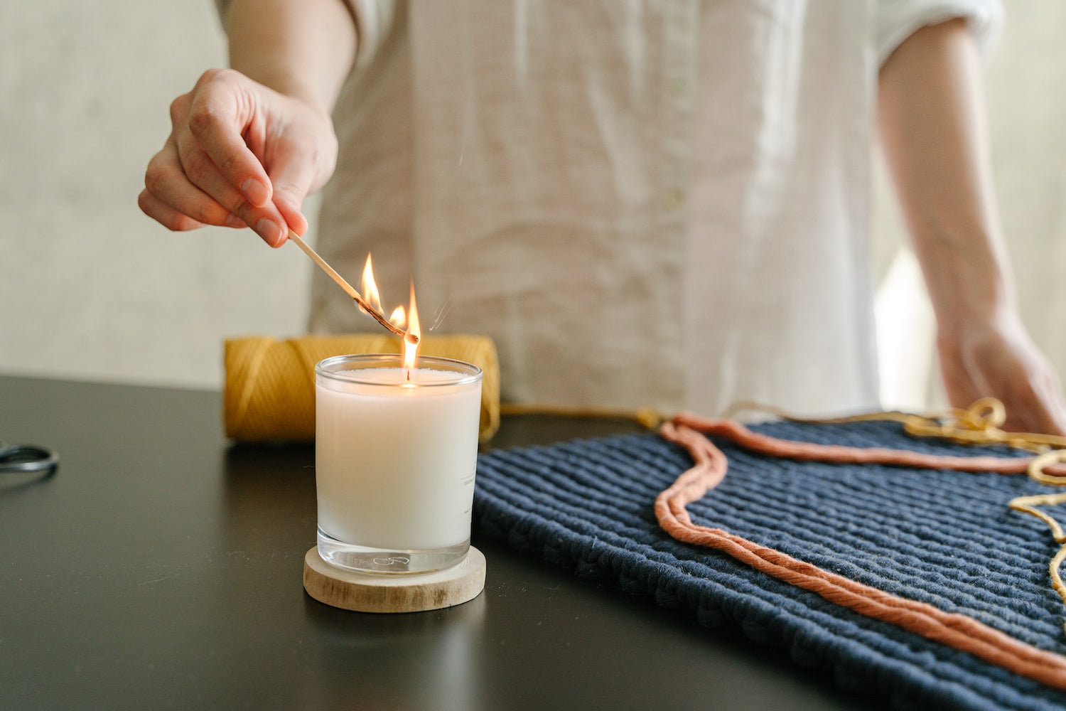 a person lighting a candle