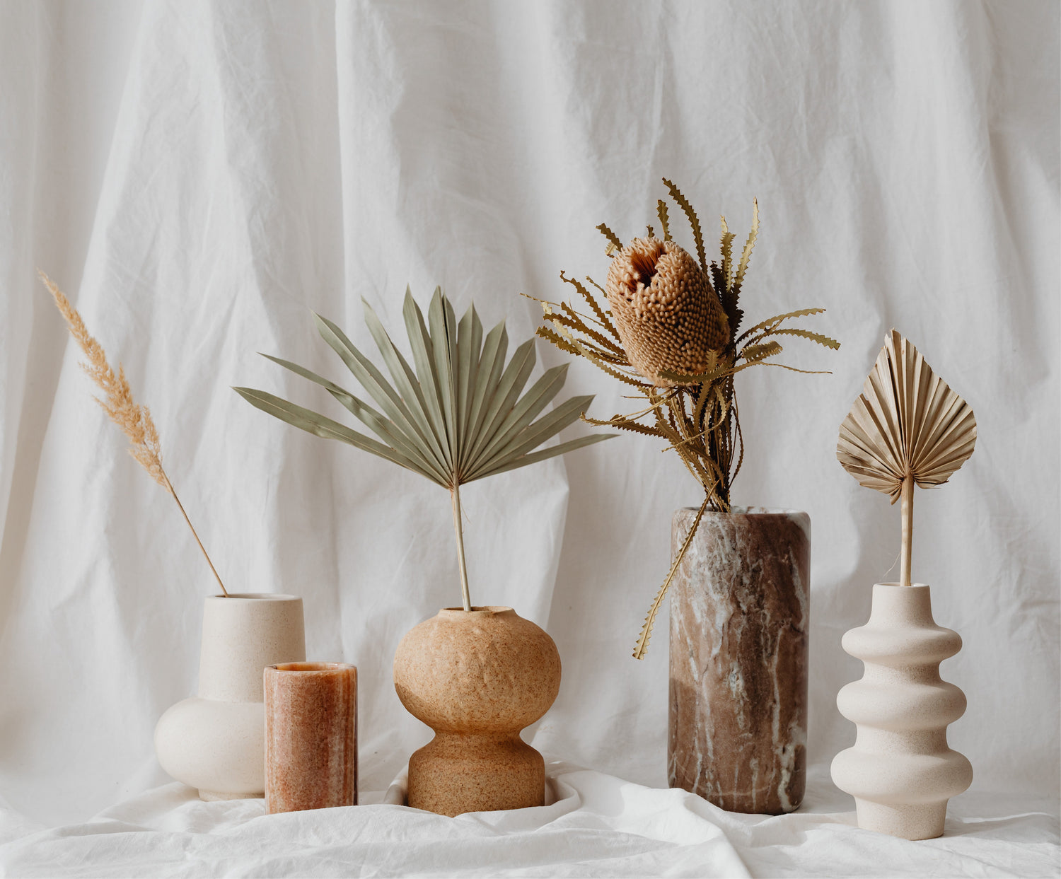 vases with dried plants